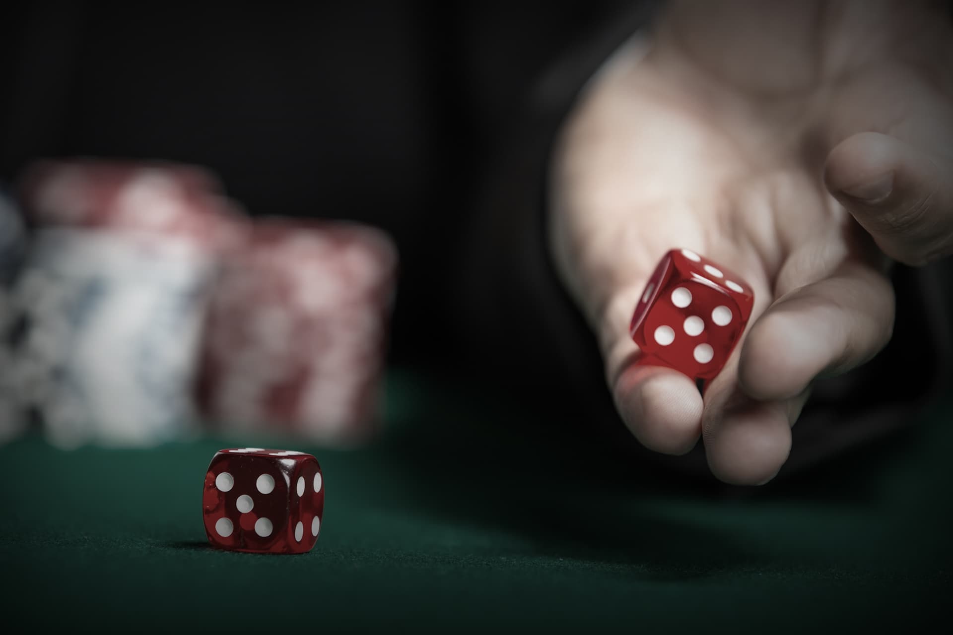 Live dealer hosting a Craps casino game on a virtual table, showing dice rolls and player bets.